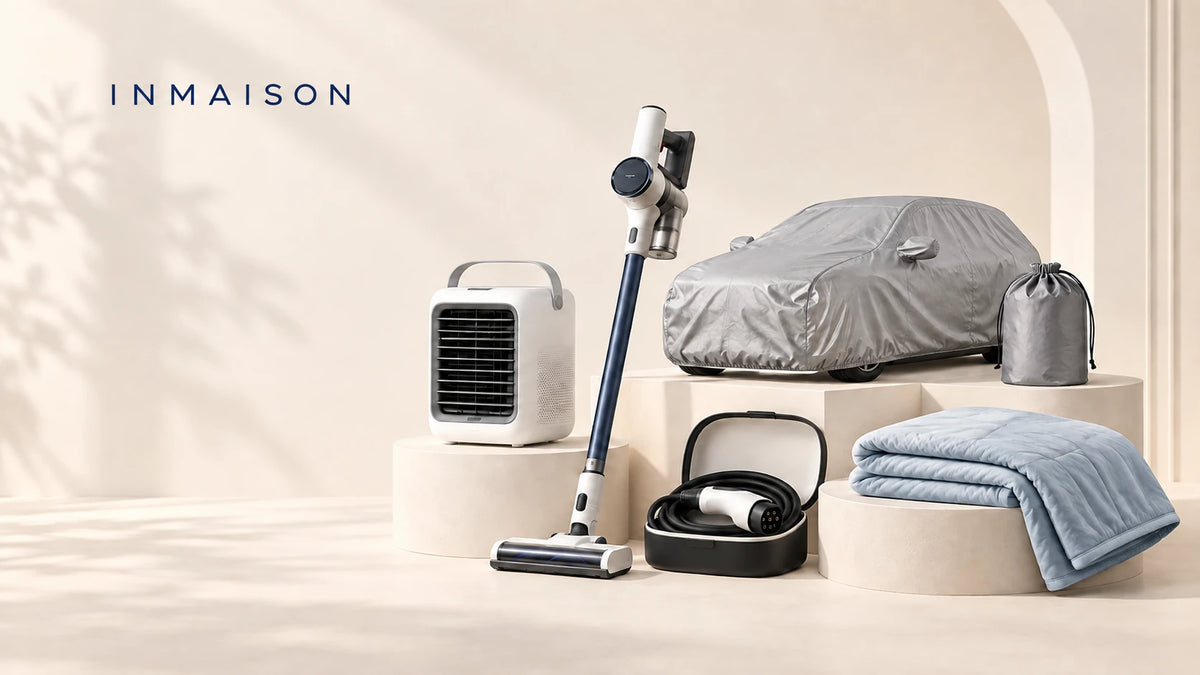 Inmaison product range on a warm neutral set — portable air cooler, cordless stick vacuum, car cover with storage bag, portable EV charger and a cooling blanket